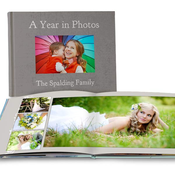 Create a custom wedding album for your photos or a year book with quality lay flat pages