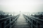 A dock disappearing into the fog makes a nice artistic picture
