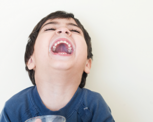 Telling jokes and being funny is a great way to cheer up a child and capture a happy photo